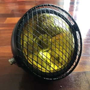Farol frontal amarelo ou transparente com grelha metálica dois apoios
