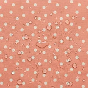 Tecido Nylon Impermeável Bolas 1cm Coral e Cru